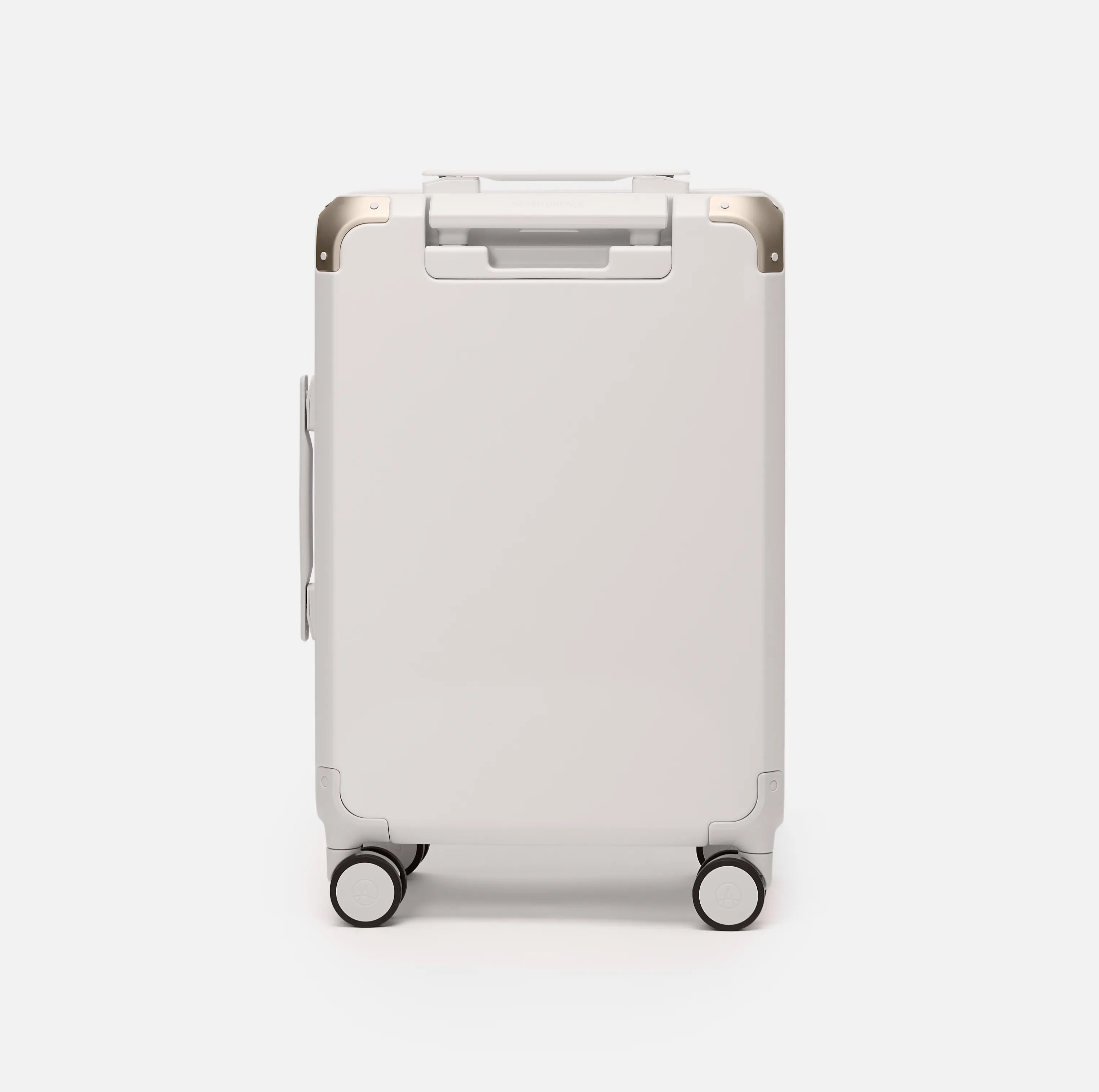 Beige hard shell carry-on suitcase, The Cabin Trunk Essential by Armoir, rear angle view