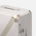 Beige hard shell luggage, The Cabin Trunk Essential by Armoir, corner detail