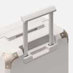 Beige carry-on luggage, The Cabin Trunk Essential by Armoir, telescopic handle detail