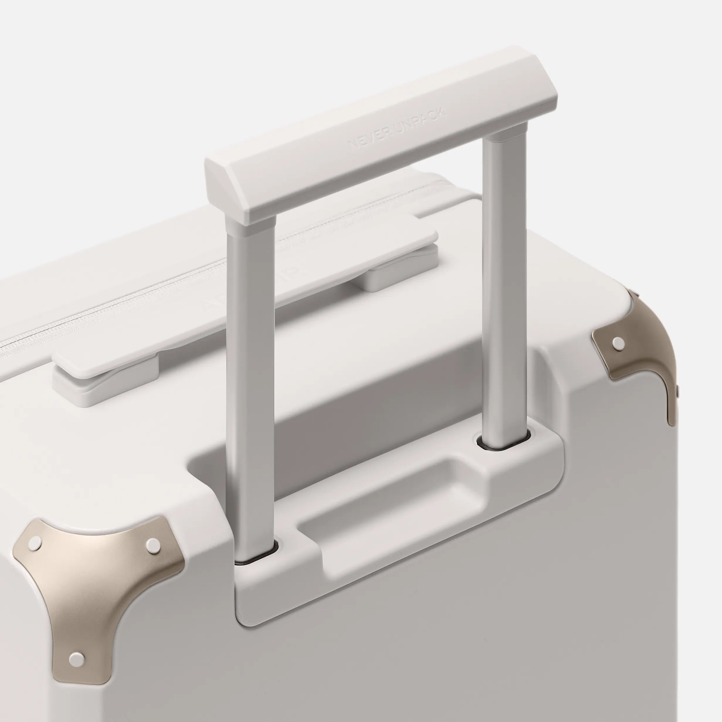 Beige carry-on luggage, The Cabin Trunk Essential by Armoir, telescopic handle detail