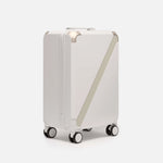 Beige premium carry-on luggage, The Cabin Trunk Essential by Armoir, front angle view