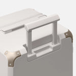 Beige checked luggage, The Large Trunk Essential by Armoir, telescopic handle detail